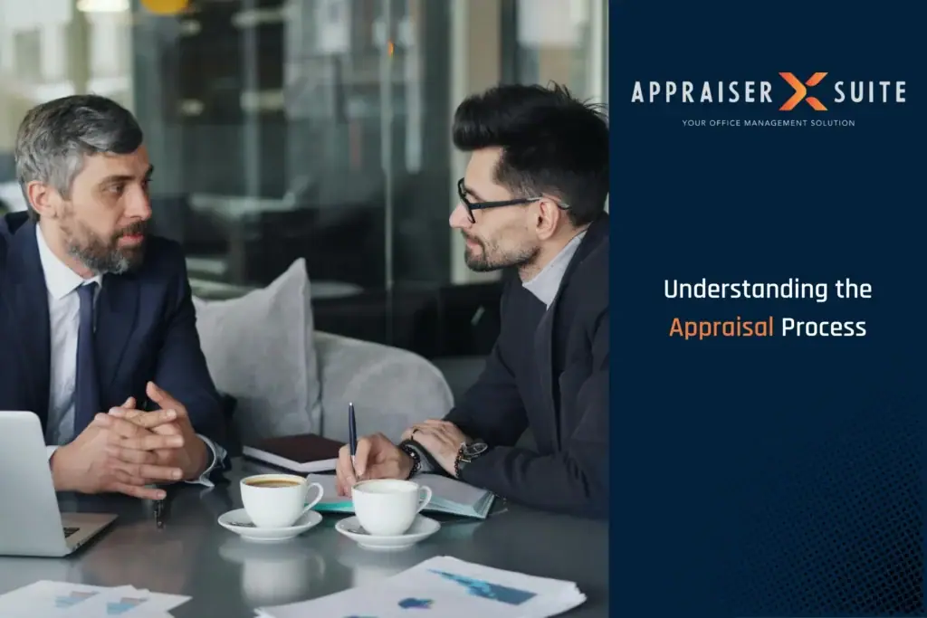 Two men having a conversation with coffee cups and a laptop sitting on a desk