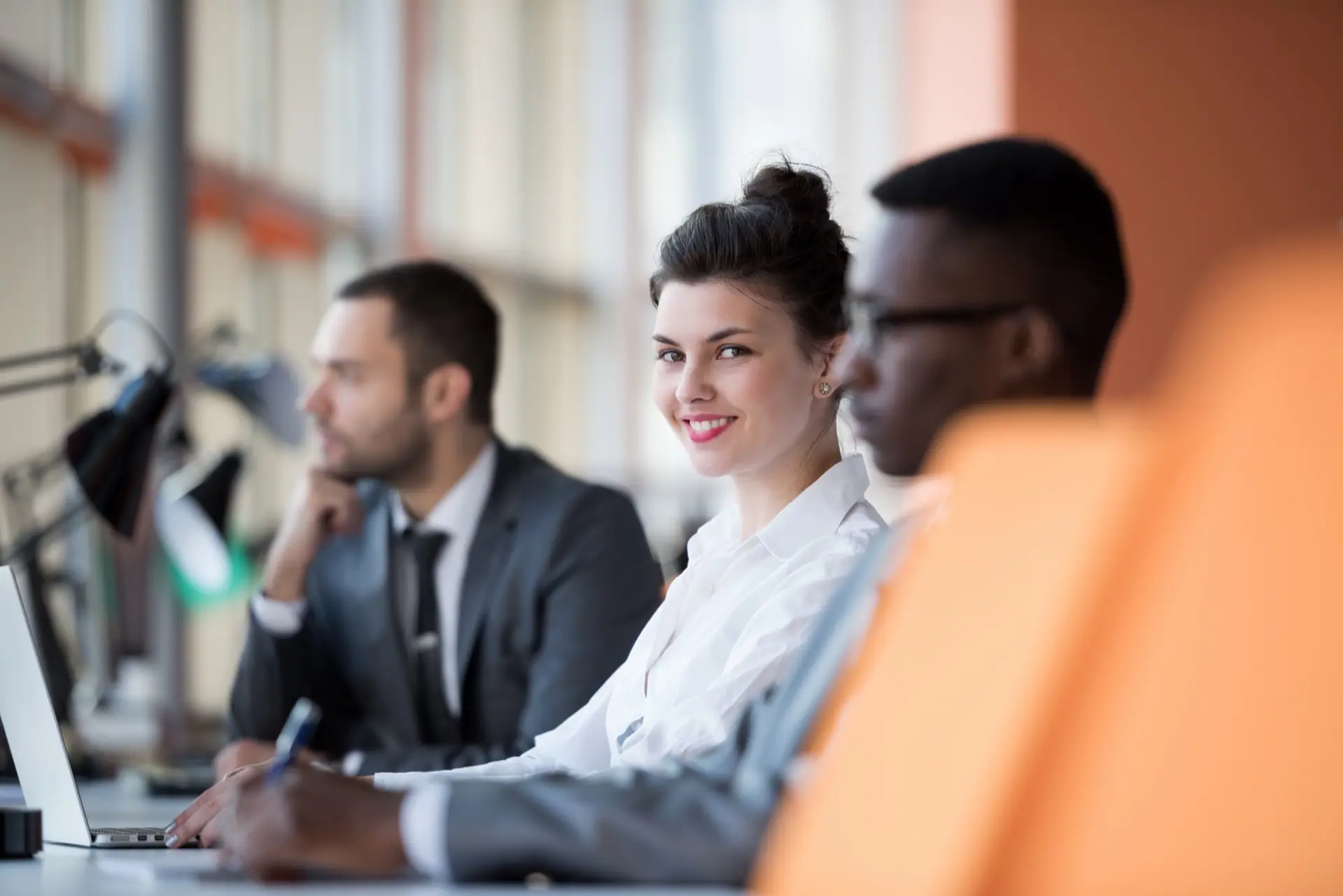Consultants working through a business plan at a shared desk